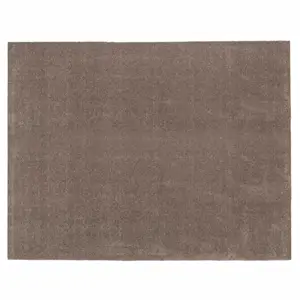 Sandfarvet rektangulært tæppe med mørk bagside synlig.