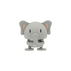 Grå elefantfigur med store ører, snabel og fjeder mellem top og bund.