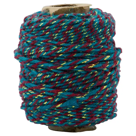 Båndspole fra House Doctor med snoet mønster i turkis, rød og gul.