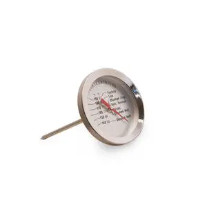 Sølvfarvet stegetermometer med runde skive og rødt nål. Viser temperaturer for kødtilberedning.