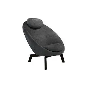 Mørkegrå loungestol med buet form, fire vinklede ben og nakkepude.