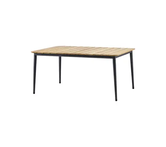 Rektangulært spisebord med teaktræsoverflade og slanke, mørke ben.