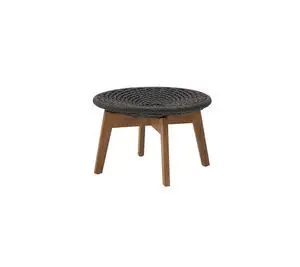 Rund fodskammel/sidebord i mørkegrå flet med teakben, enkel og velegnet til udendørs brug.