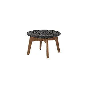 Rund fodskammel/sidebord i mørkegrå flet med teakben, enkel og velegnet til udendørs brug.