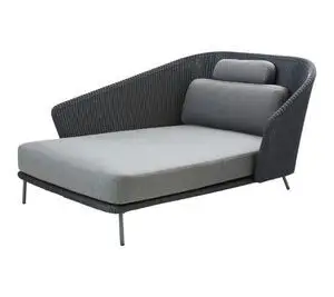 Daybed med højre ryglæn, slanke ben og grå hynder, herunder ryg- og sædehynder, i grafitfarve.