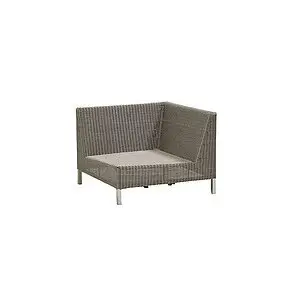 Hjørnesofa med vævet tekstur, lav ryg og sæde, slanke ben. Designet af Cane-line.