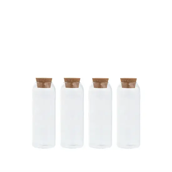 Fire gennemsigtige krydderikrukker med korklåg, enkel cylindrisk form, set forfra.