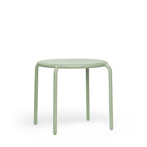 Rundt, minimalistisk bistrobord i lys grøn med fire ben og hul i midten af bordpladen.