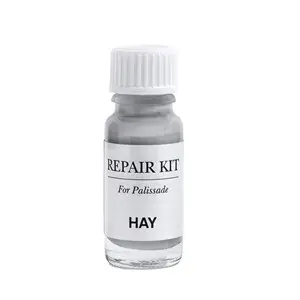 Lille flaske med hvid skruelåg, mærket "REPAIR KIT For Palissade" fra HAY, til Palissade produkter.