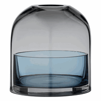 Domeformet genstand med glat overflade, sort til navy gradient og skinnende finish.