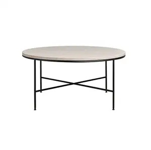 Rundt sofabord med lys cremefarvet bordplade og tynde sorte metalben i kryds.