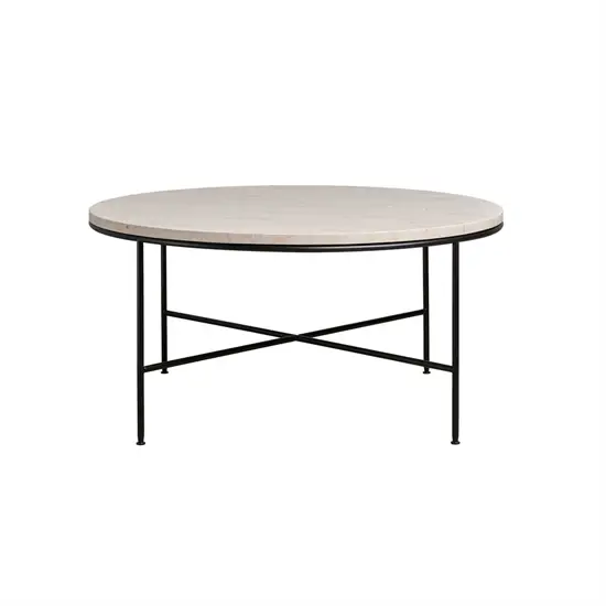 Rundt sofabord med lys cremefarvet bordplade og tynde sorte metalben i kryds.