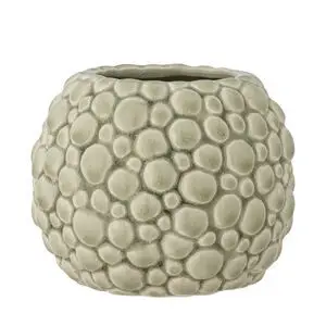 Rund, mønstret urtepotteskjuler i grønt stentøj med glat, blank overflade.