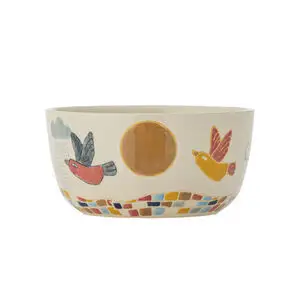 Skål med farverige fugle, sol og sky på ydersiden. Indersiden er glat og neutral i farven.