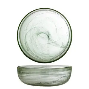 Rund grøn skål i gennemsigtigt glas med glat overflade og dekorativ swirl-effekt.