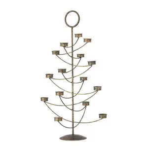 Dekorativ fyrfadsstage i guldmetal, formet som et stiliseret træ med symmetriske lys holdere.