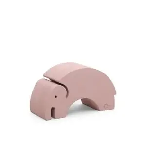 Elefantformet objekt i vintage rose med glatte kurver, designet til leg og kreativitet.