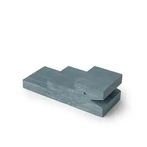 Blåt krokodilleformet produkt med marmoreringseffekt og trinlignende struktur.