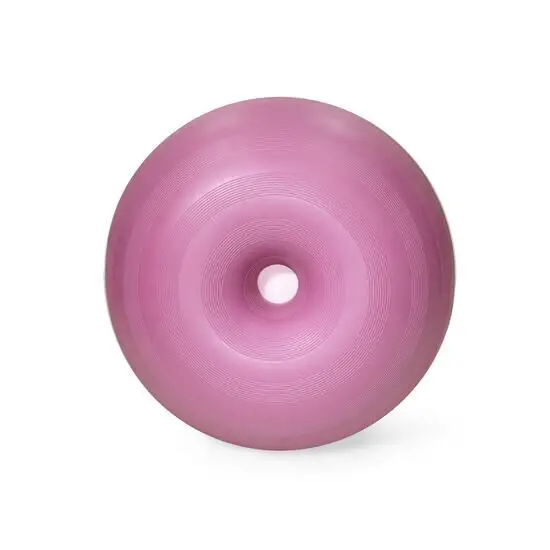 Stor, mørk pink donutformet genstand med hul i midten og koncentriske cirkulære mønstre.