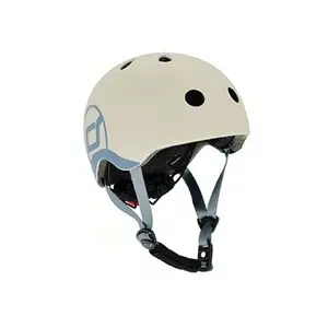Børnecykelhjelm i lysegrå med ventilationshuller, justerbare stropper og en sidegrafik.