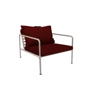 Stol med hvidt stel og røde puder, moderne design.