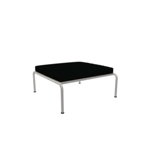 Minimalist ottoman med mørk pude og hvidt stel, fra Houe AVON, enkel og stilren.