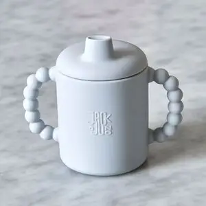 Grå tudekop med afrundet design, spout-låg og bobleformede håndtag for nemt greb.
