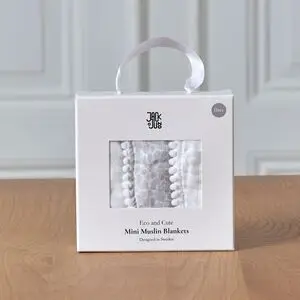 Pakke med hvide mini muslin tæpper med kant, i en rektangulær æske med bærehåndtag.