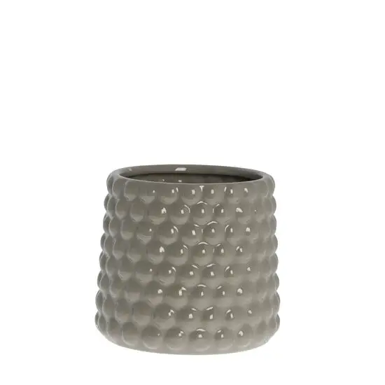 Grå keramisk potte med cylindrisk form og prikket tekstur.