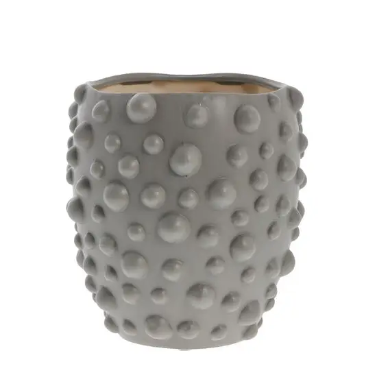 Grå, cylindrisk potte med tekstureret overflade og hævede knopper, designet af Lene Bjerre.
