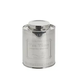 Sølvfarvet, cylindrisk krukke med tekst "Tea Time" og "Premium Quality" på forsiden.