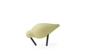 Lille, stiliseret fugl med gul krop og sorte ben, minimalistisk og moderne design.