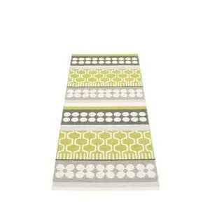 Tæppe med symmetrisk mønster af limegrønne, hvide og grå cirkler samt abstrakte former.