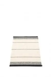Rektangulært tæppe med sorte og hvide striber, sorte kanter og tekstureret overflade.