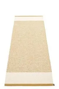 Rektangulært tæppe med lys okker center, vanilje kanter og beige metallisk grænse.