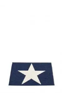 Mørkeblåt rektangulært tæppe med en stor hvid stjerne i midten.