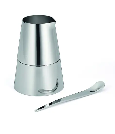 Moderne sæt med skinnende flødekande, sukkerskål og ske i minimalistisk design.