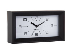 Rektangulært ur med sort ramme, hvid skive, sorte tal og "Karlsson" mærke.