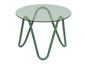Rundt bord med glasplade og grønne, buede metalben i moderne design.