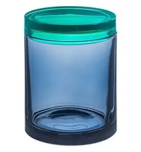 Stor cylindrisk glasbeholder med gennemsigtigt korpus og farvet låg, der skaber kontrast.