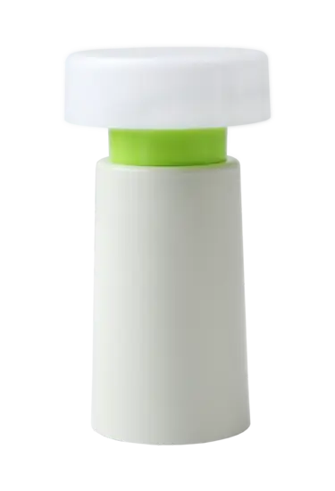 Enkel bordlampe med hvid base, grøn bånd og gennemsigtig top. Cylindrisk og moderne design.